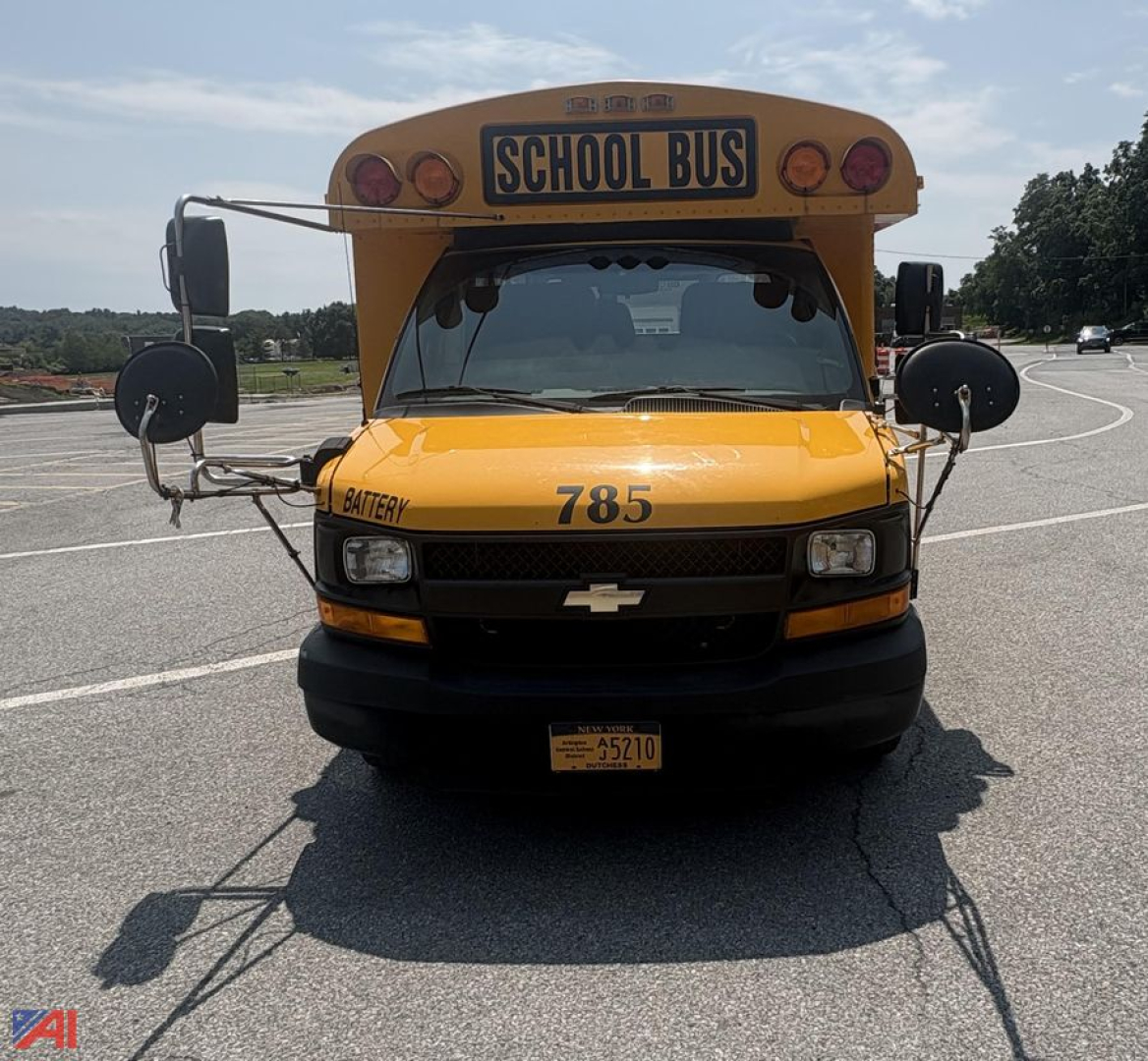 Front view of a yellow 2017 Chevrolet Thomas Express G4500 school bus with 'SCHOOL BUS' sign, number 785, and mirrors.
