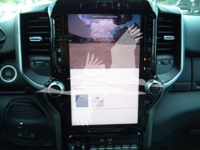 Ram 5500 dashboard center touchscreen display showing backup camera view and UI elements.