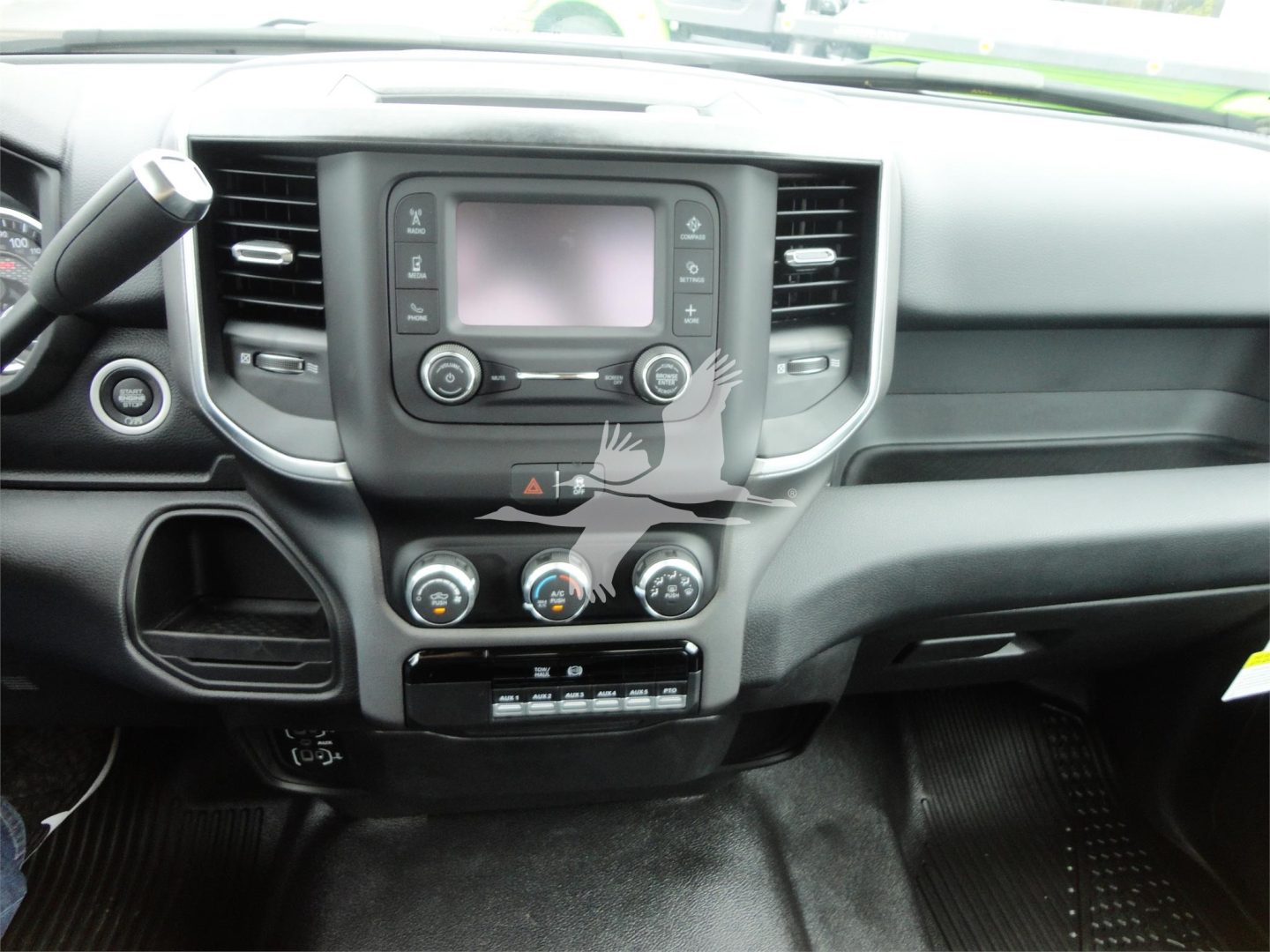 Ram 5500 HD SLT dashboard center console showing touchscreen infotainment, climate controls, and gear selectors.