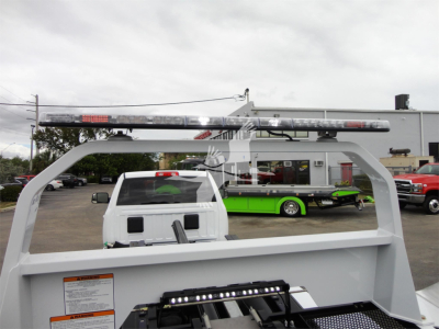 Ram 5500 rollback truck bed with light bar on top showing stock image from dealership.