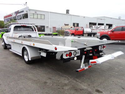 Flatbed tow truck rear cargo area with hydraulic bed extension and rear lights