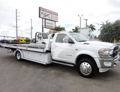 Ram 5500 heavy-duty pickup tow truck side view showing rollback bed and dual rear wheels.