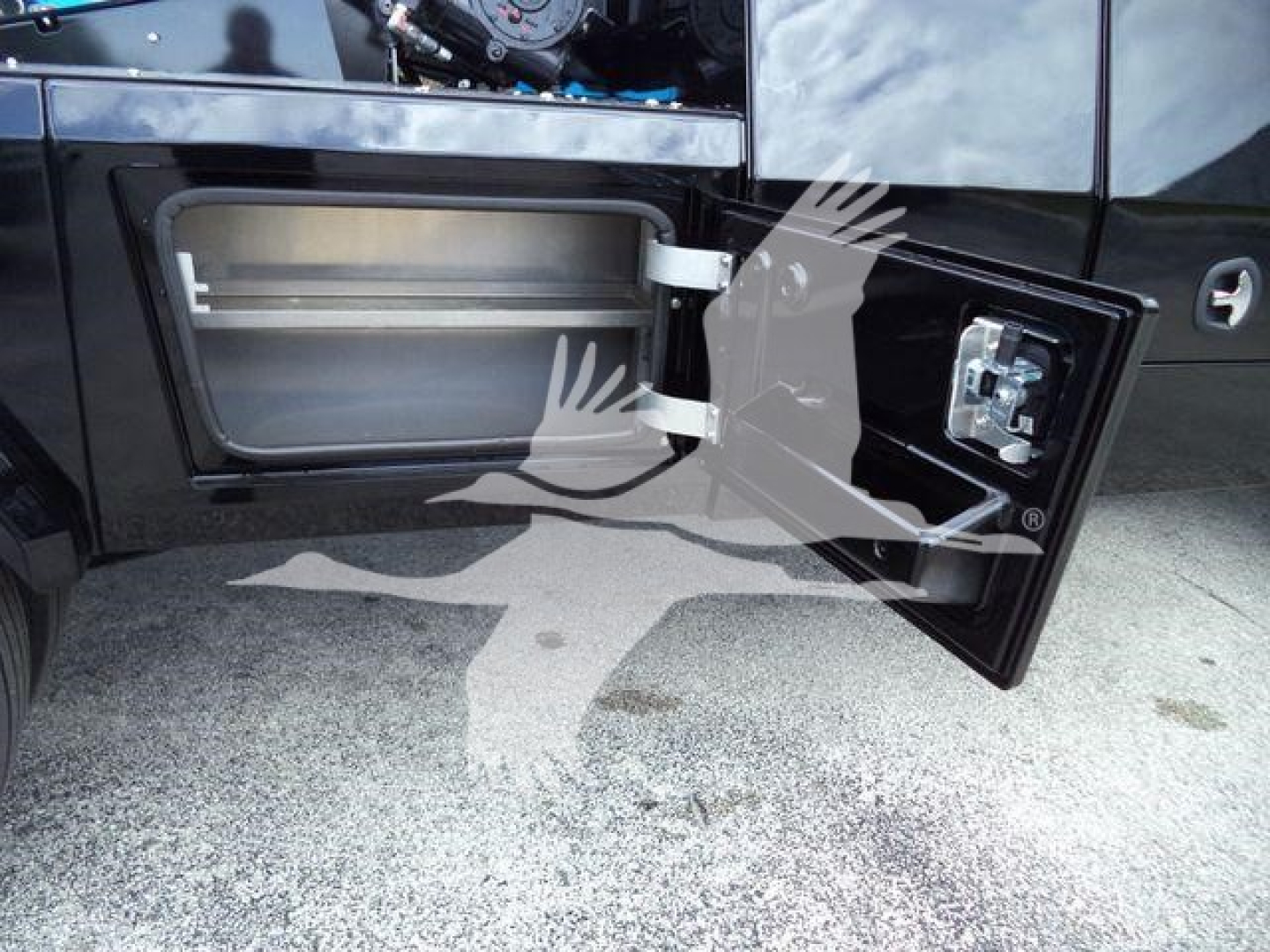Trucks showing a side fuel door open revealing a storage compartment and winch controls panel inside the door