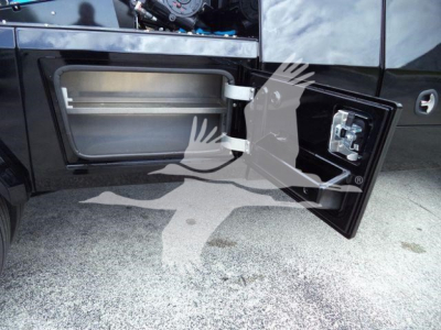 Trucks showing a side fuel door open revealing a storage compartment and winch controls panel inside the door