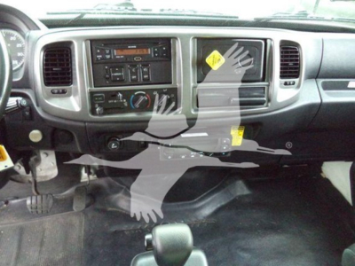 Cab interior of a 2015 Hino 268a refrigerated truck showing dashboard controls and center radio panel.