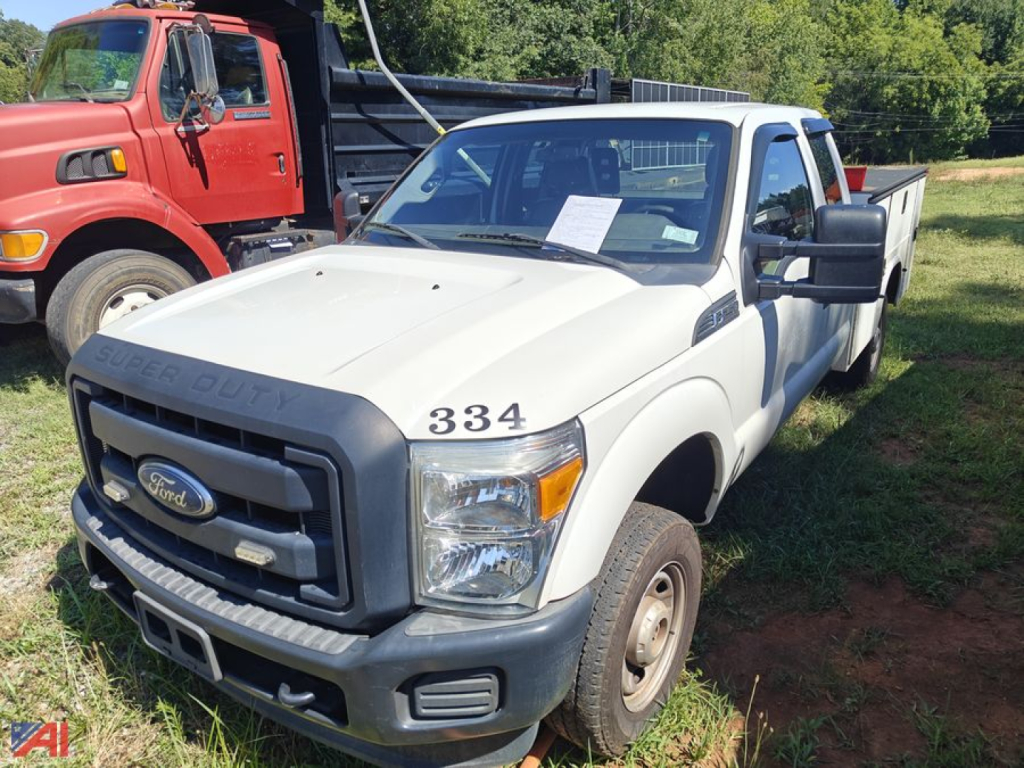 Ford F-250 Super Duty pickup truck in white, front-left view, with 334 badge on hood, parked on grass; captioned as used with Ford emblem grille.