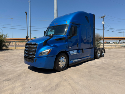 Freightliner PT126064ST truck in blue, front-left view showing cab and sleeper with chrome grille