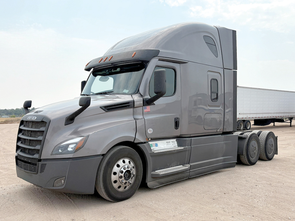 Freightliner Cascadia126 tractor in profile view showing sleeper cab, front bumper, and wheels.