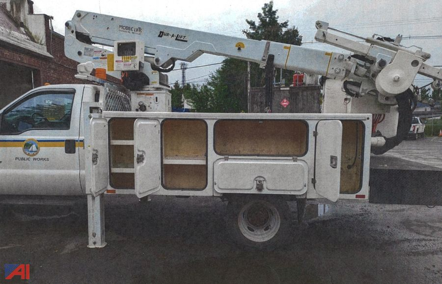 Ford F-550 bucket truck body with mounted boom and service compartments in a used condition.