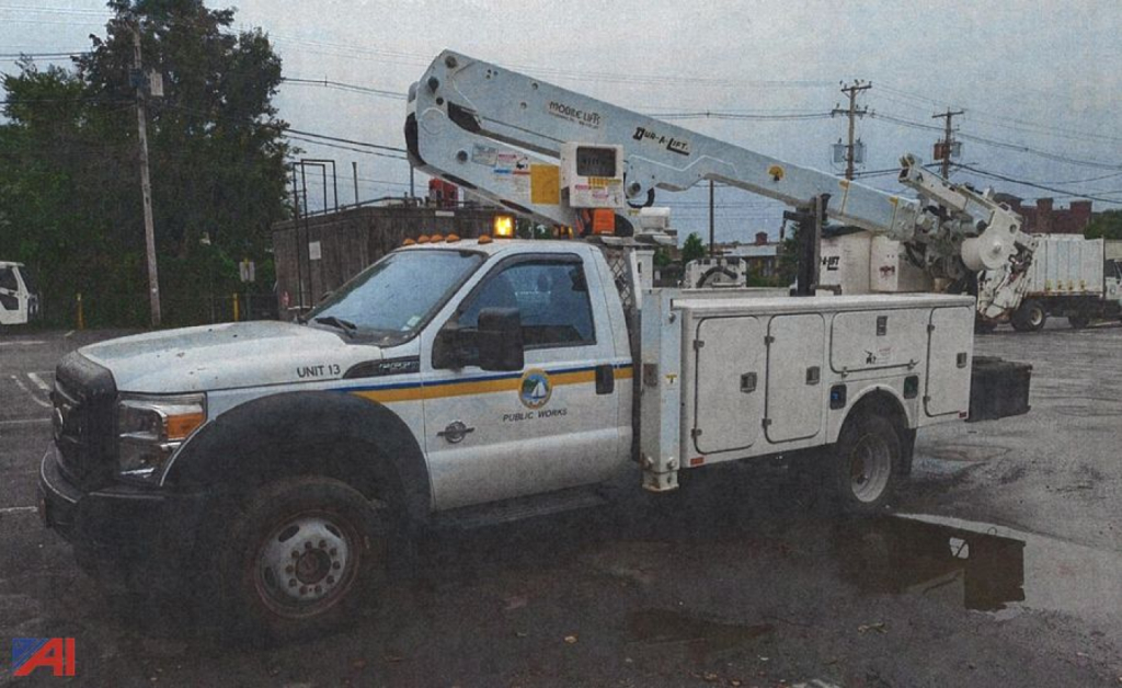 Ford F-550 bucket truck with boom lift and service body, front view, side marking UNIT 13, utility decals.