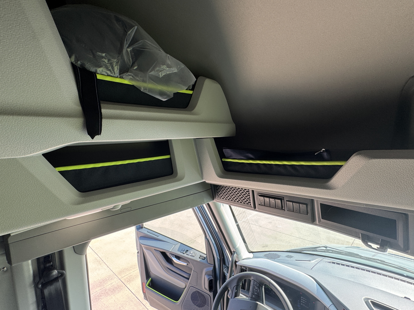 Volvo VNL64T860 cab interior overhead sleeper area showing storage compartments and breathable bags.