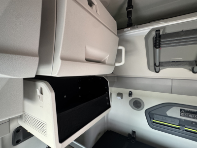 Volvo VNL64T860 truck interior cab area with storage compartments and control panel visible.