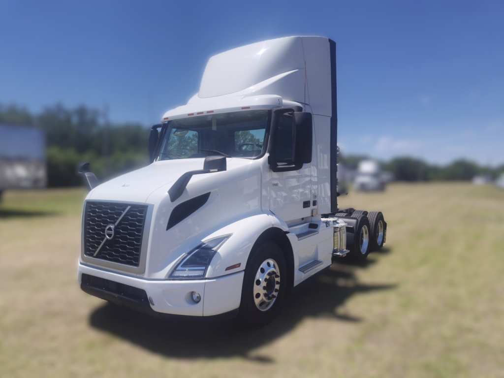 2022 Volvo VNR64T300 tractor-trailer cab showing front grille with Volvo emblem and top sleeper cab.
