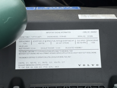 Label on engine information panel showing important engine data for Volvo diesel engine: engine family, displacement, intake rocker, exhaust rocker, idle speed, brake specs, and Emissions controls. Volvo logo visible.