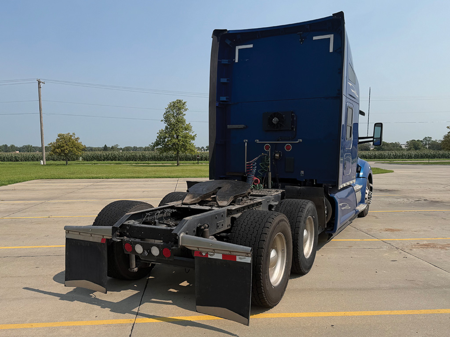 Kenworth T-680 rear view showing tractor chassis and dual rear axles.