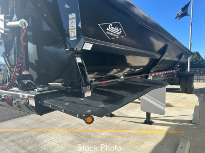SmithCo SX2-4034 dump trailer in stock showing side view with hydraulic lift and SmithCo logo on black body.