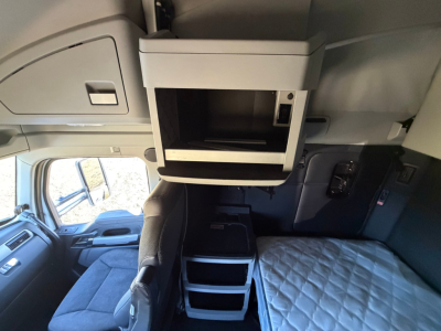 Kenworth T680 interior sleeper cab upper storage compartment and ladder shelves visible
