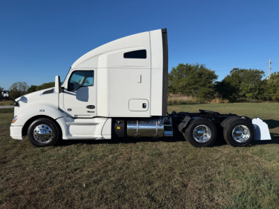 Kenworth T680 truck side view showing sleeper cab, chassis, and dual rear axles.