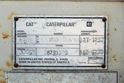 Caterpillar data plate on a 1996 Caterpillar 330L MH showing model number 330L, serial 08791099, engine 08 791099, parts order 200-? (grainy plate).