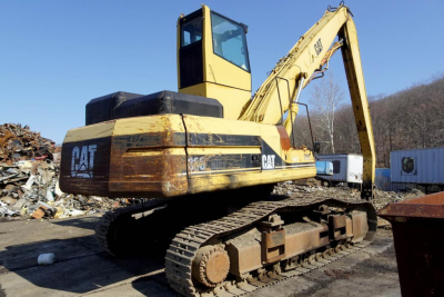 Caterpillar 330L MH excavator in serviceable condition with tracked undercarriage and yellow paint, side view showing CAT branding and WINCH/boom arm.