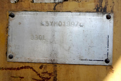 Plate on Caterpillar 330L MH showing VIN 05YM01997 and model 330L.