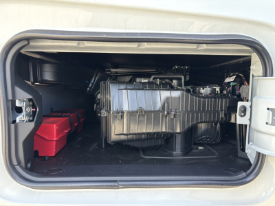  Volvo VNL64T640 engine bay showing battery box and various components in the front sleeper area.