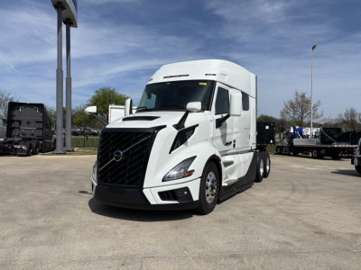 Volvo VNL64T640 tractor-trailer in white, front three-quarter view, showing aerodynamic cab and grille.