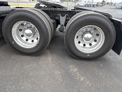 International LT625 truck tandem rear wheels showing dual tires and chrome rims.
