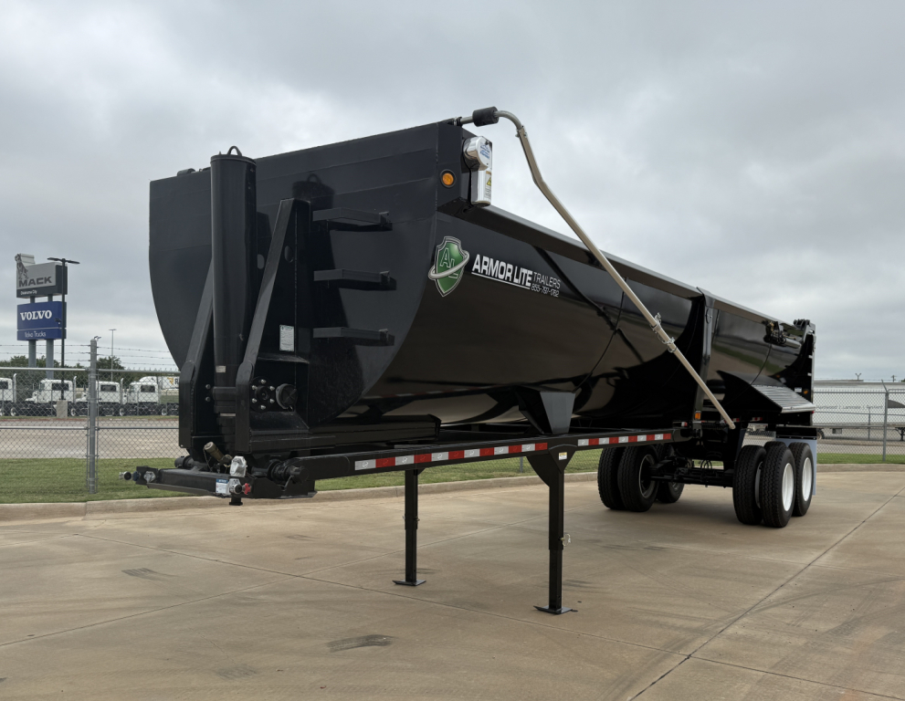Armor Lite SHD32/48 dump trailer showing side profile, black hopper, dual rear wheels, and landing gear with support leg and reflective striping.