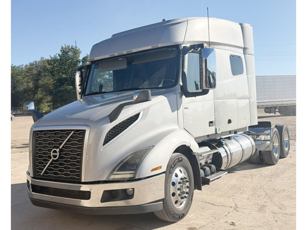 Volvo VNL 740 tractor cab profile showing front grille, headlights, and side fuel tanks.