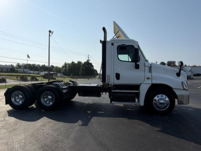 Freightliner Cascadia 126 side view showing truck chassis and cab with white paint.