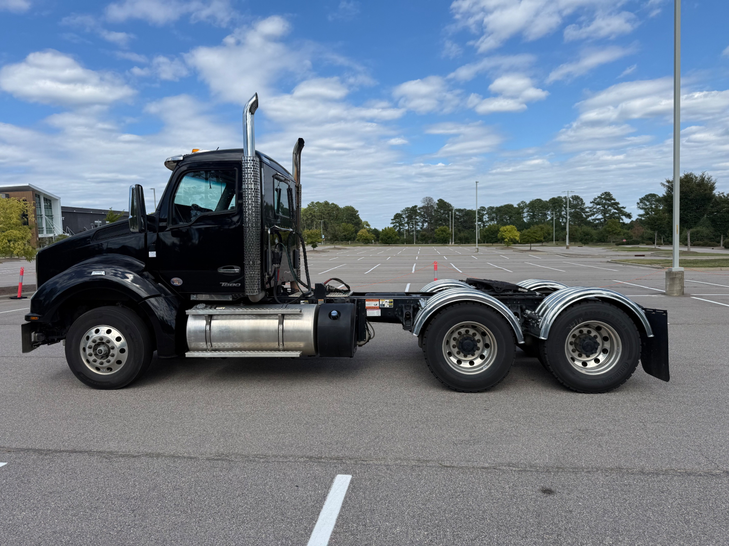 Kenworth T880 truck side view showing 6x4 heavy-duty tractor configuration and dual rear axles.