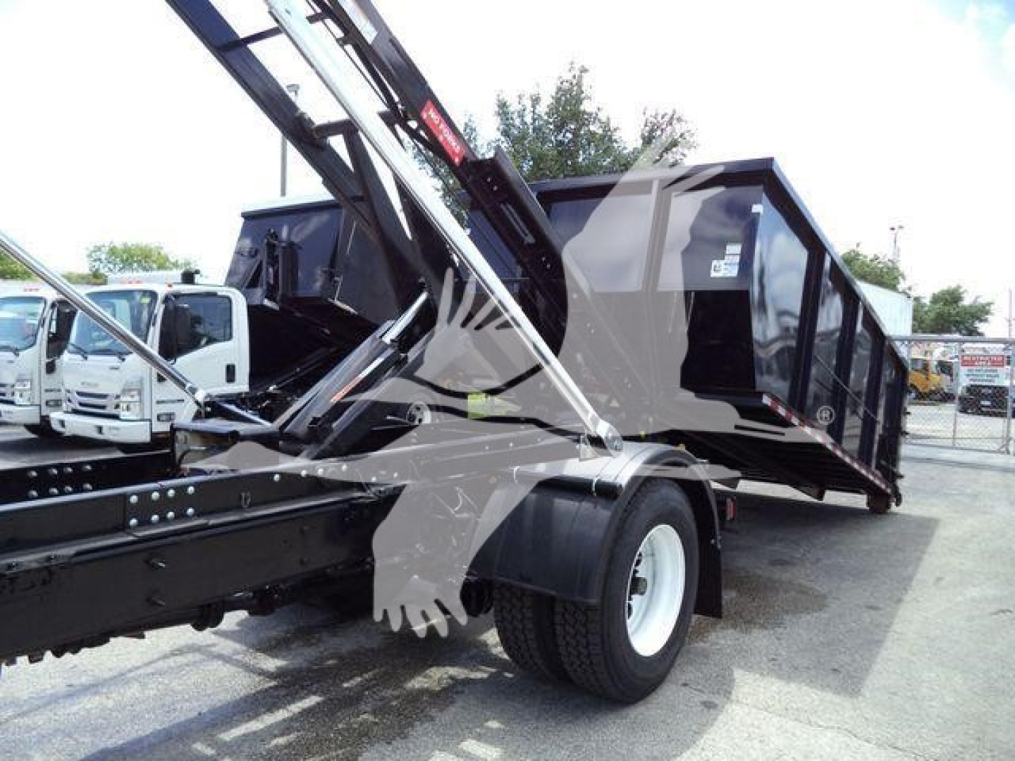 Truck bed with hydraulic loading crane and dump bed in a rolling trailer setup; International 4300 model, used, VIN 1HTEUMML3KH322676.