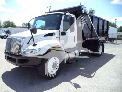 2019 International 4300 roll-off truck shown in side/front angle with white cab and black dump bed; visible grille and headlamps; stock/ID notations not visible on image.