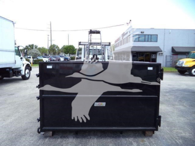 Rear view of a black roll-off truck bed with graphic eagle wings and crane system, International 2019 model.