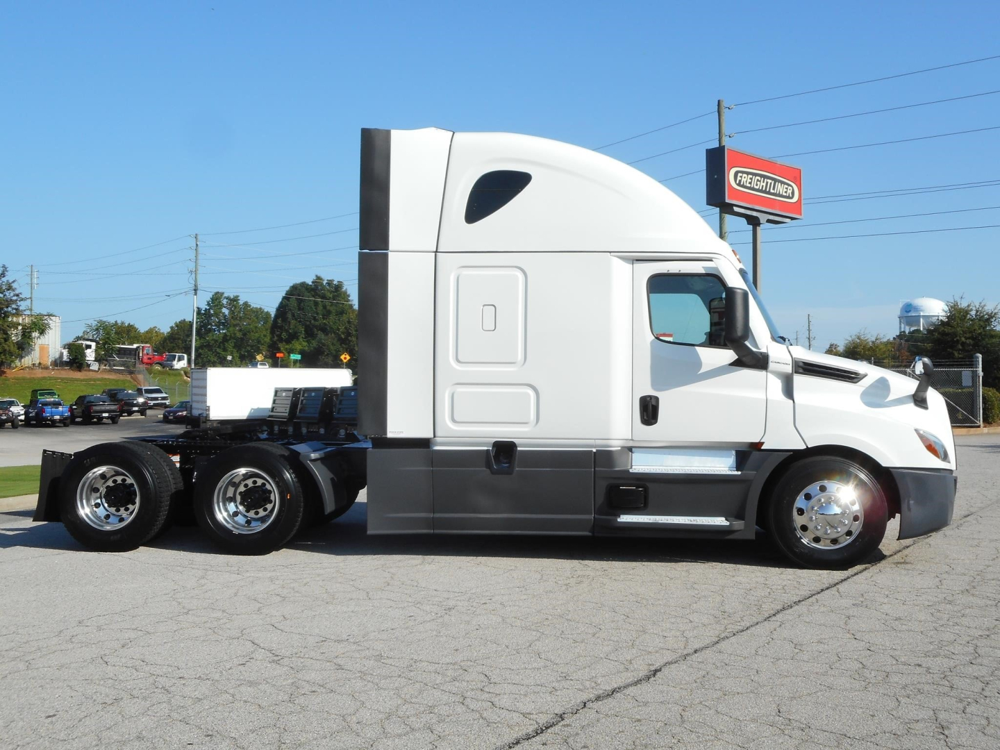 Freightliner Cascadia 126 semi-truck side profile with sleeper cab in white and chrome accents.