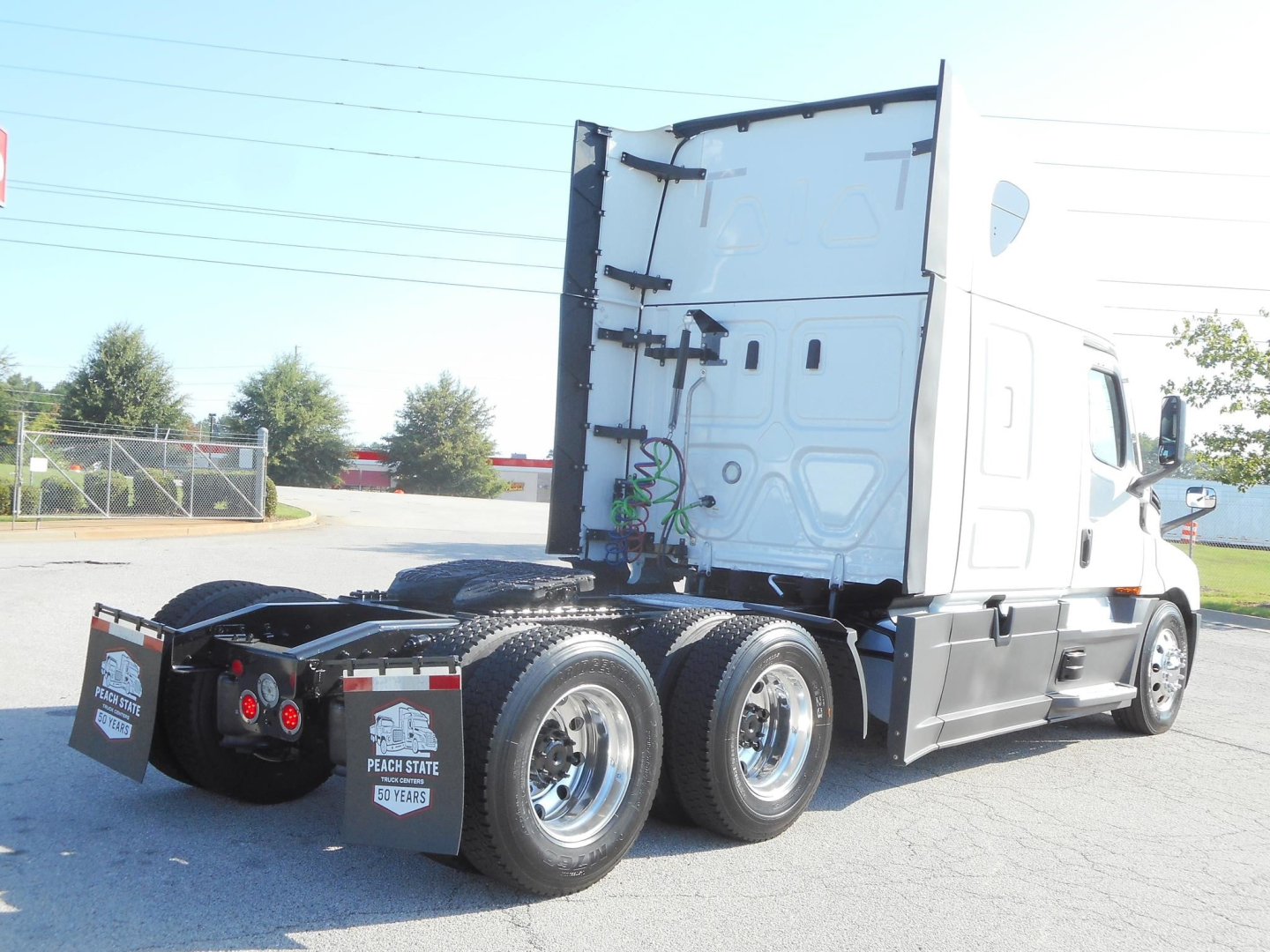 Freightliner Cascadia 126 tractor-trailer chassis with sleeper cab, rear view showing dual rear axles and fifth wheel, white cab, stock number 362169, VIN partially visible.