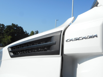 Front of 2024 Freightliner Cascadia 126 truck showing Cascadia badge and grille.