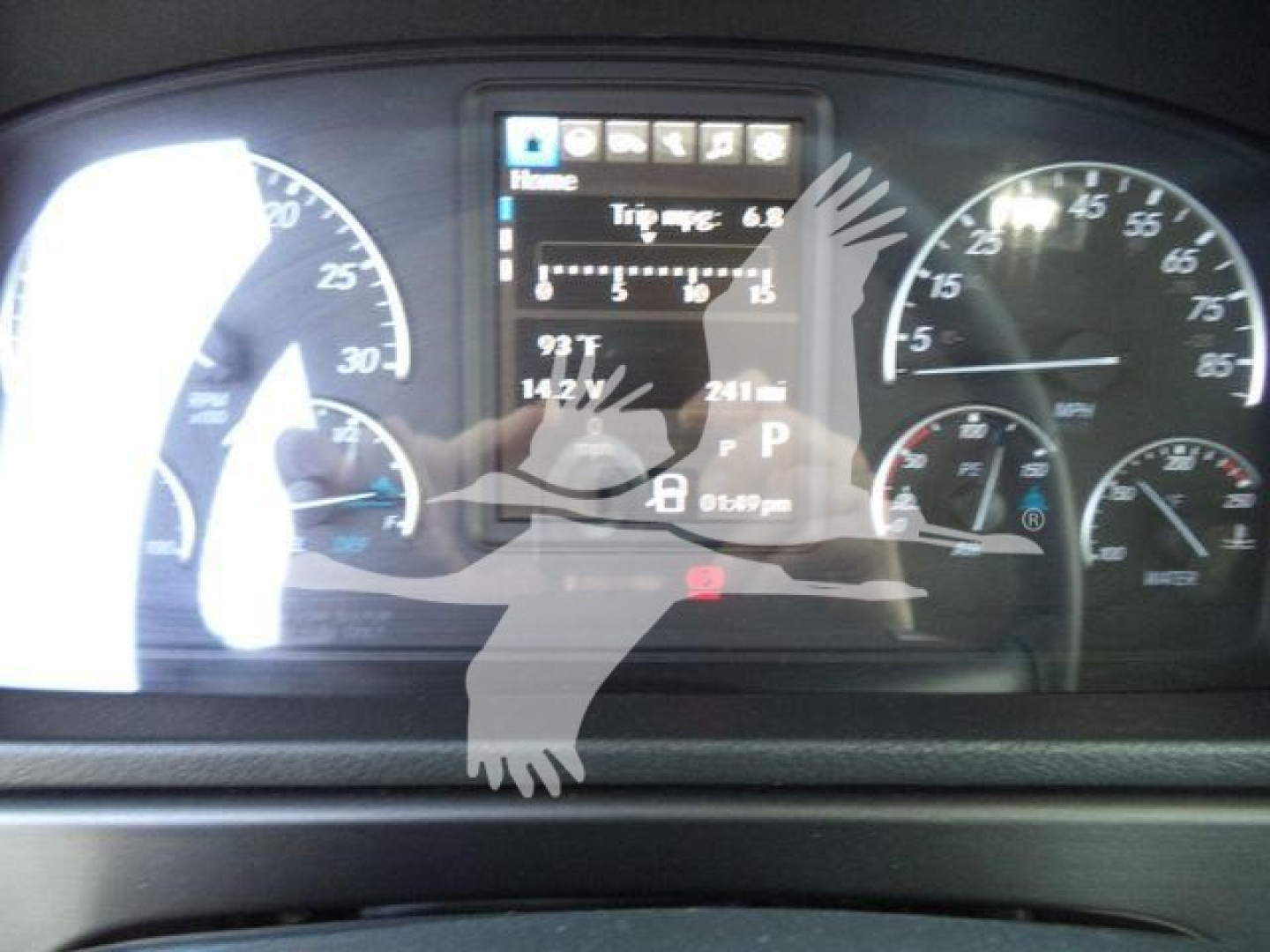 Truck dashboard showing multiple gauges and a center digital display in a Freightliner Business Class M2 106 cab.