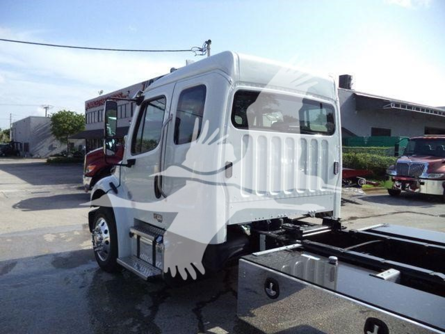 Truck cab of a 2027 Freightliner Business Class M2 106, side view, white cab, with chassis and wheels visible.