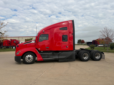 Kenworth T680 tractor showing side profile with red cab and sleeper, rear wheels, and no trailer. Vehicle lines and wheel wells visible.
