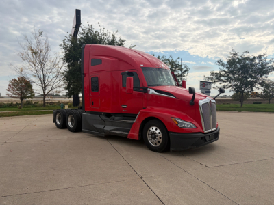 Kenworth T680 truck in red, side view showing tractor cab with sleeper, front grille, and chrome wheels.