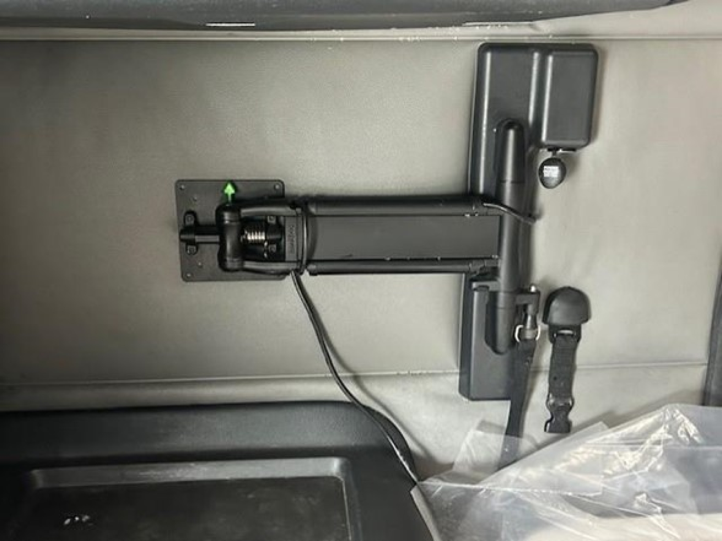 Rear view showing a hitch with a manual or electric trailer brake/locking mechanism and a small lever; no legible branding or serials visible.