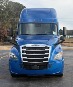  Freightliner Cascadia 126 front view showing blue exterior and chrome grille with emblem, headlights, and mirrors.
