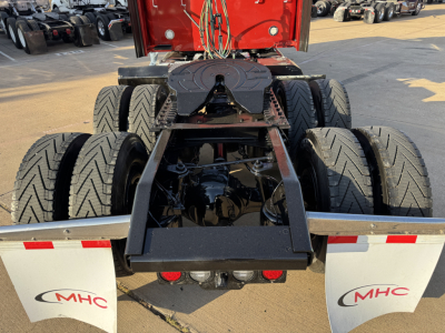 Kenworth W900L rear chassis and fifth wheel area showing dual rear twin axles and suspension components.