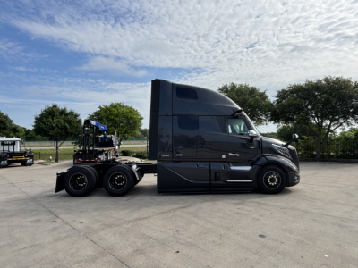 Volvo VNL64T860 tractor in profile view showing cab and chassis with no trailer.