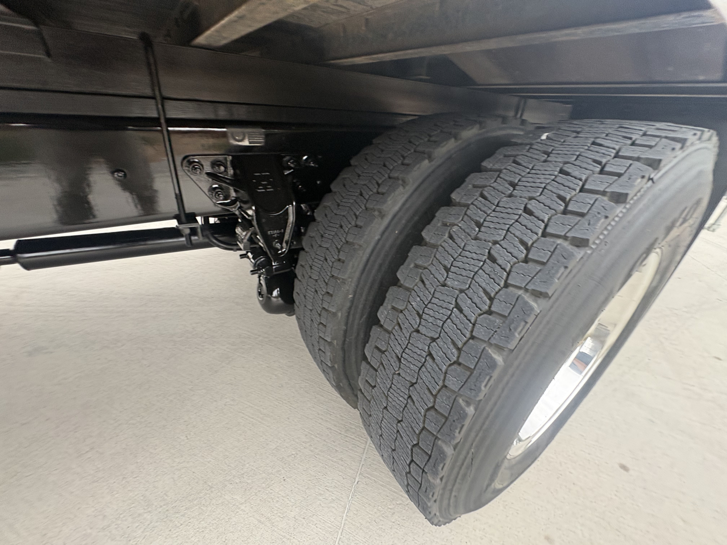 Kenworth T270 truck axle and dual rear tires showing suspension and frame undercarriage.
