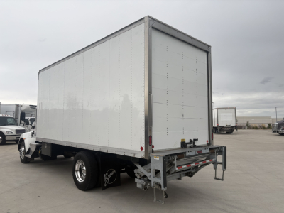 Kenworth T270 box truck rear-side view showing cargo box and dual rear wheels.