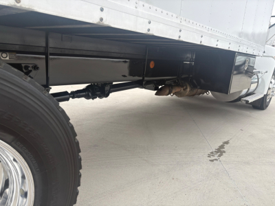 Kenworth T270 truck undercarriage showing drive shaft and rear axle with black undercarriage and trailer box