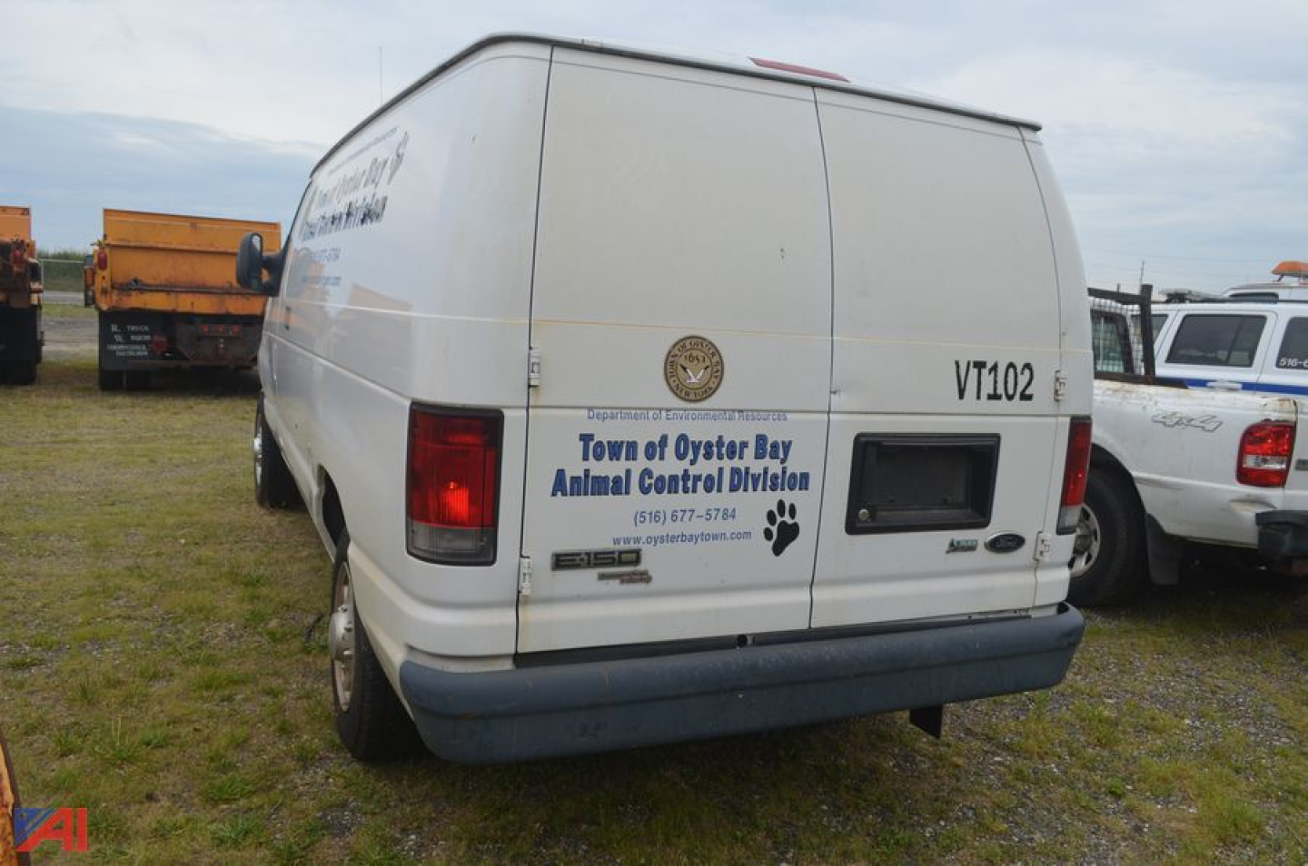 Ford Econoline cargo van rear view showing VT102 badge and Town of Oyster Bay Animal Control logo decal on rear door